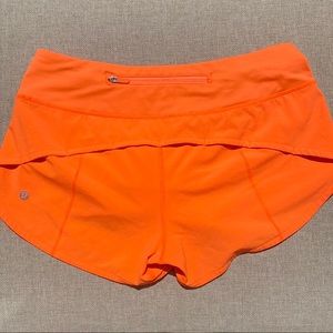 Lululemon highlight orange speed up shorts// low rise, size 4, 2.5 inseam